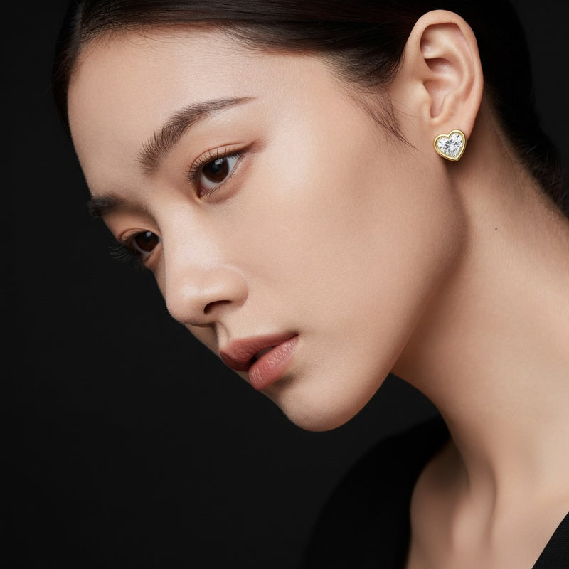 Model wearing heart bezel set stud earrings