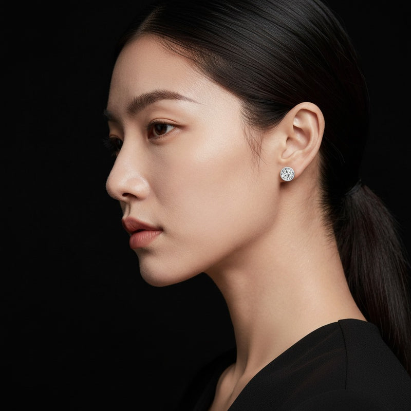 Model wearing round earrings