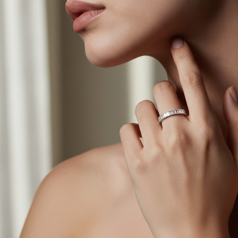 Model wearing emerald lab grown diamond split prong eternity ring