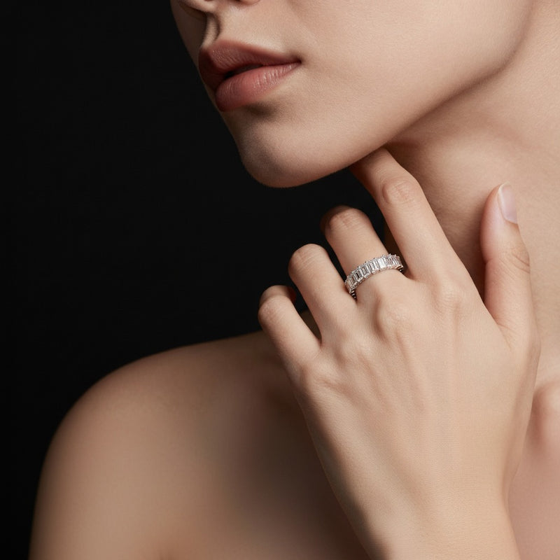 Model wearing emerald lab grown diamond split prong eternity ring