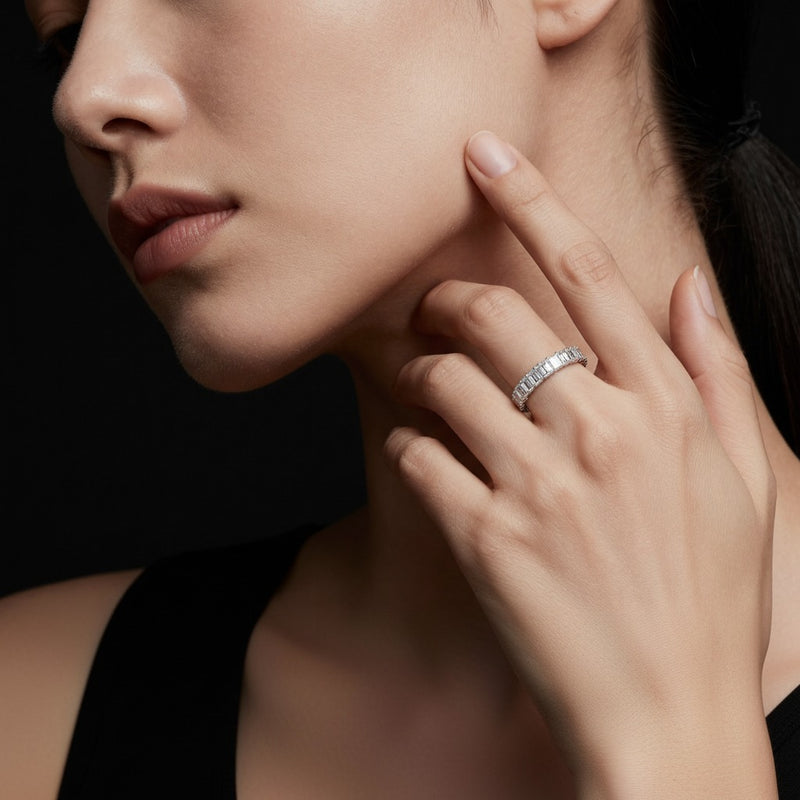 Model wearing emerald lab grown diamond split prong eternity ring