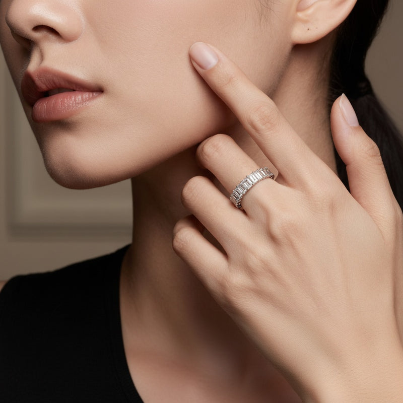 Model wearing emerald lab grown diamond split prong eternity ring