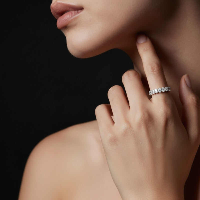 Model wearing oval lab grown diamond split prong eternity ring