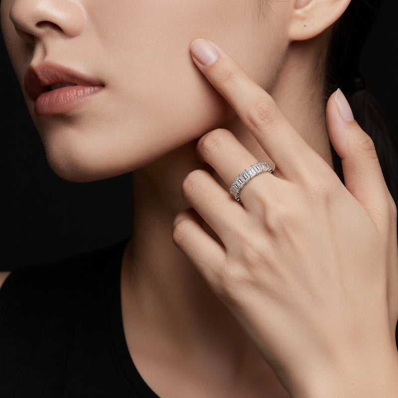 Model wearing emerald lab grown diamond split prong eternity ring