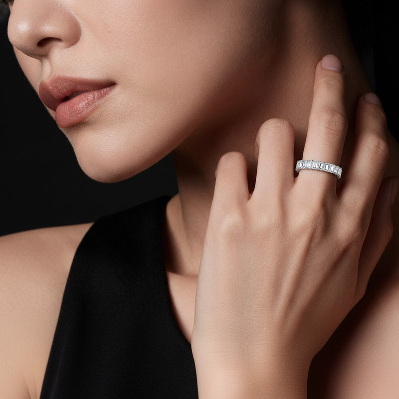 Model wearing emerald lab grown diamond split prong eternity ring
