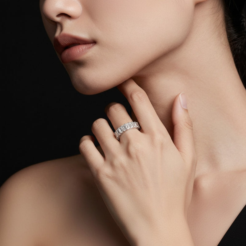 Model wearing emerald lab grown diamond split prong eternity ring