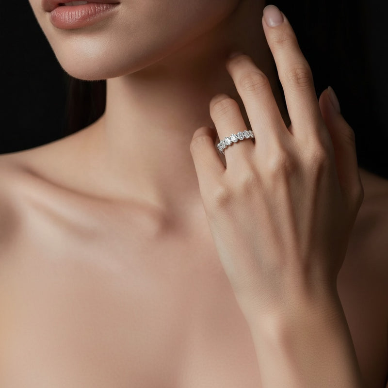 Model wearing oval lab grown diamond split prong eternity ring