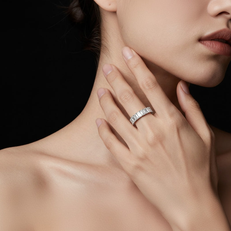 Model wearing emerald lab grown diamond split prong eternity ring