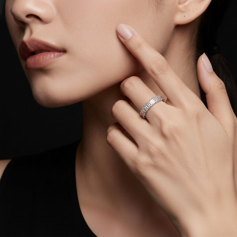 Model wearing emerald lab grown diamond split prong eternity ring