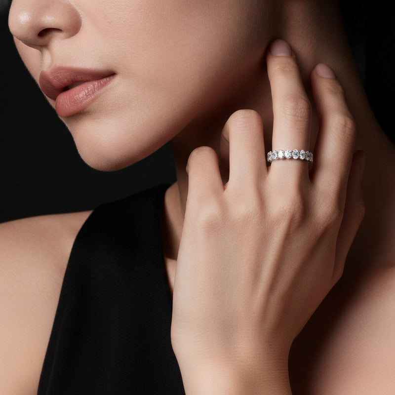 Model wearing oval lab grown diamond split prong eternity ring