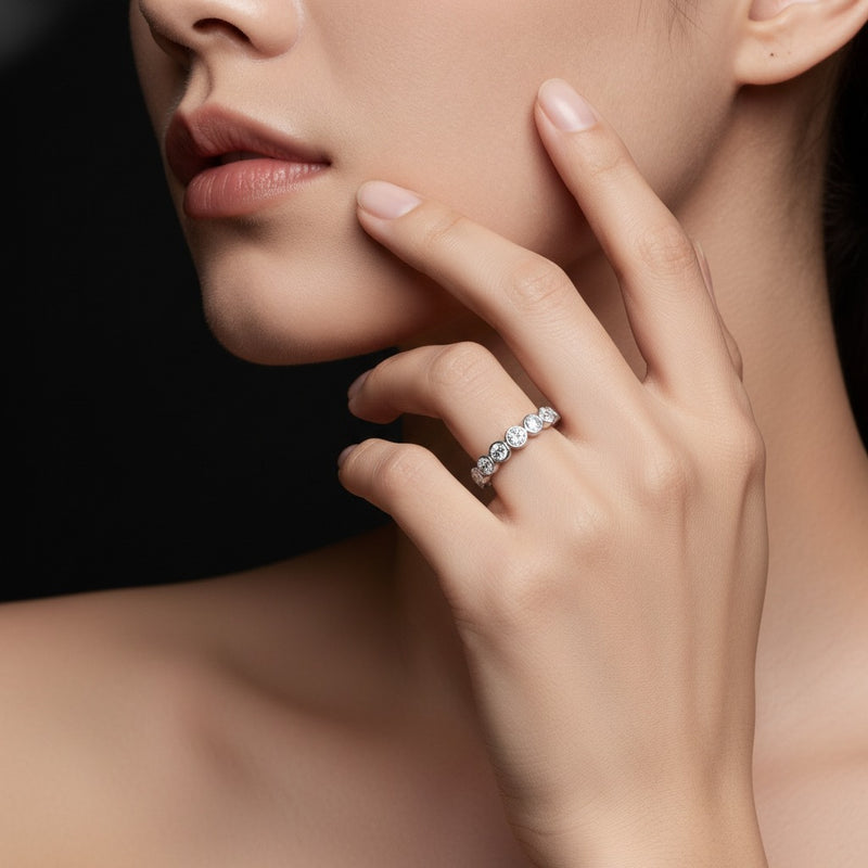 Model wearing round eternity band ring