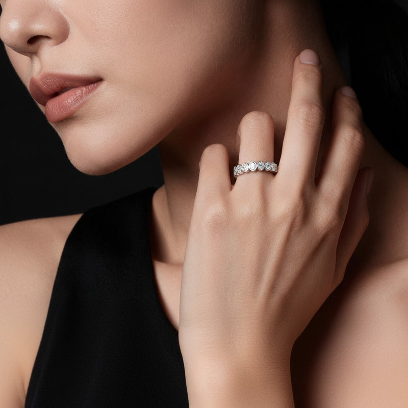 Model wearing oval eternity band ring